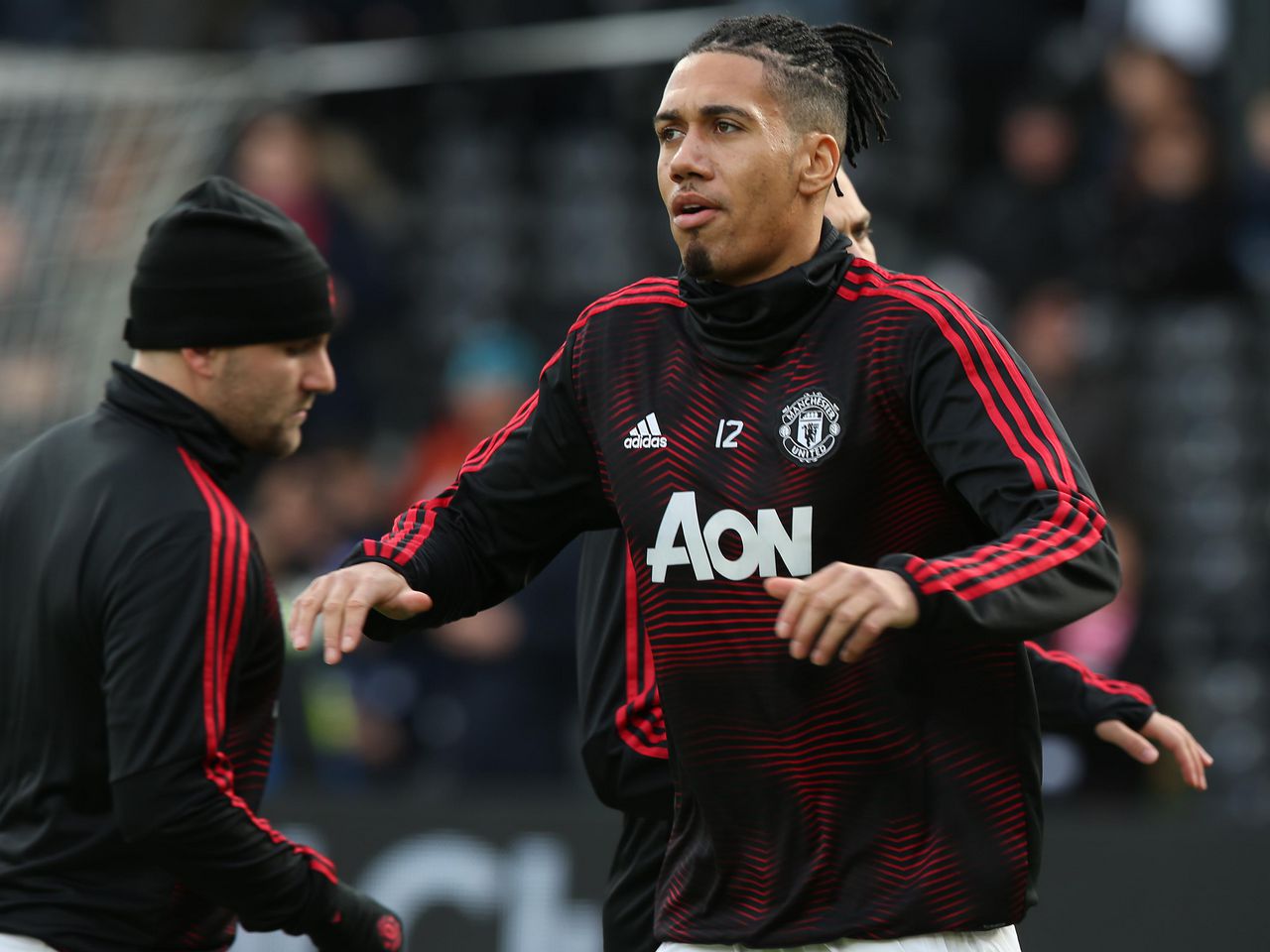 Chris Smalling warms up before the Fulham match