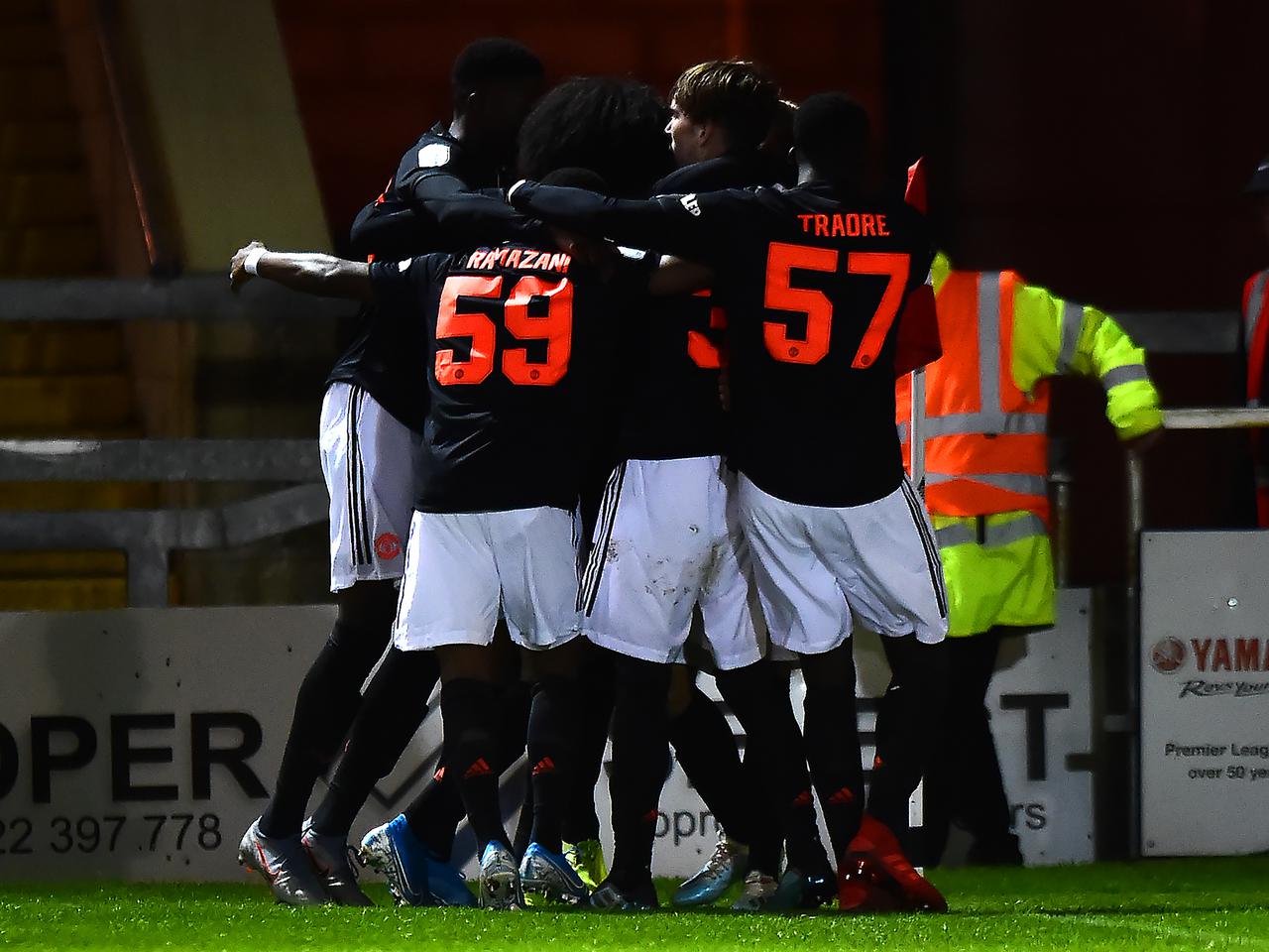 Manchester United Under-21 players celebrate James Garner's goal against Lincoln City