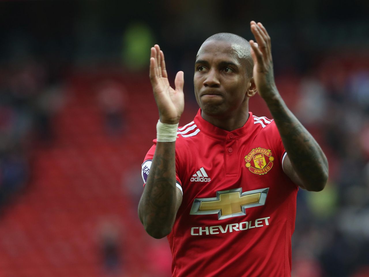 Ashley Young clapping the fans after beating Arsenal at Old Trafford.