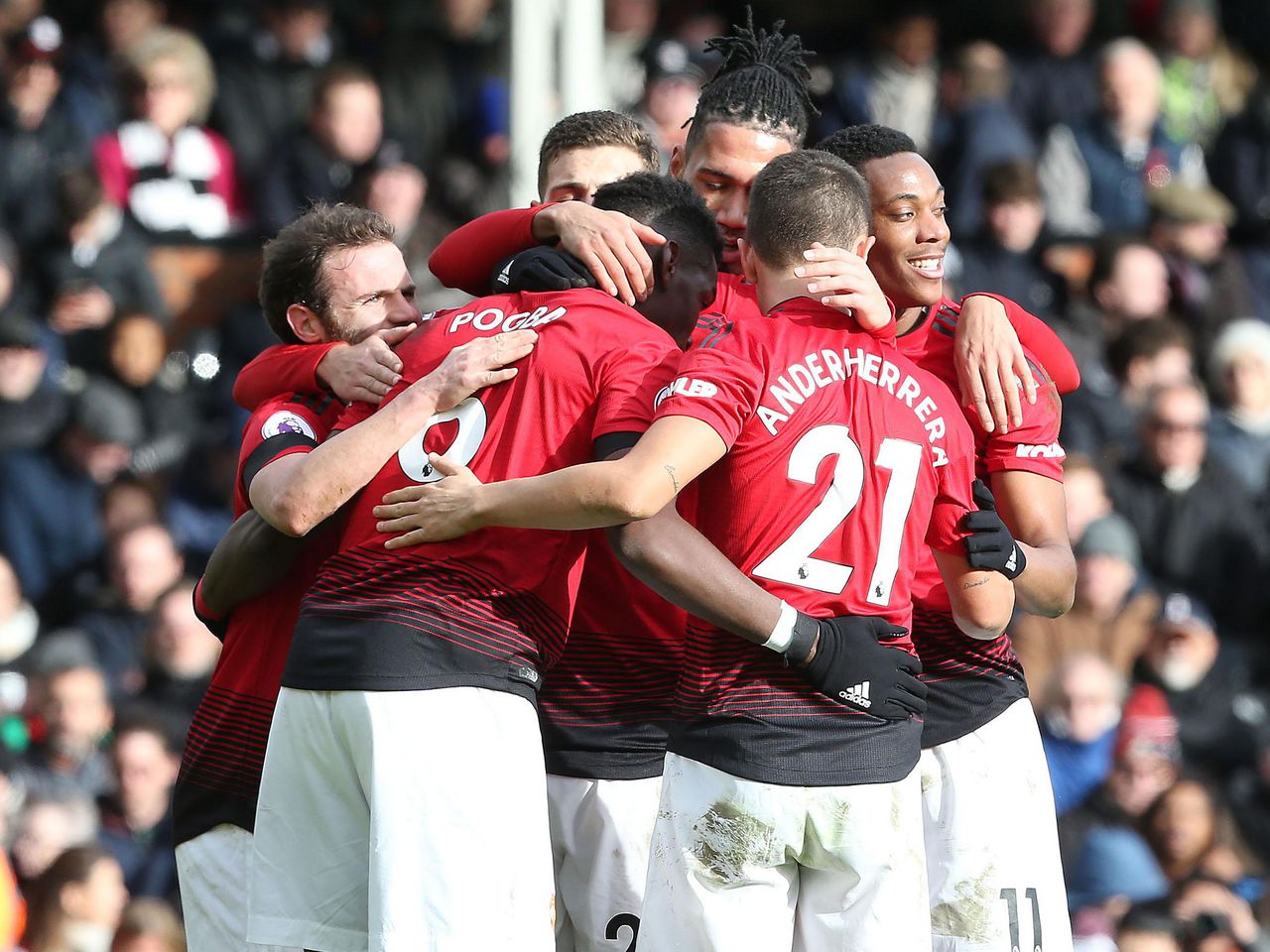Manchester United players celebrate during the 3-0 win over Fulham
