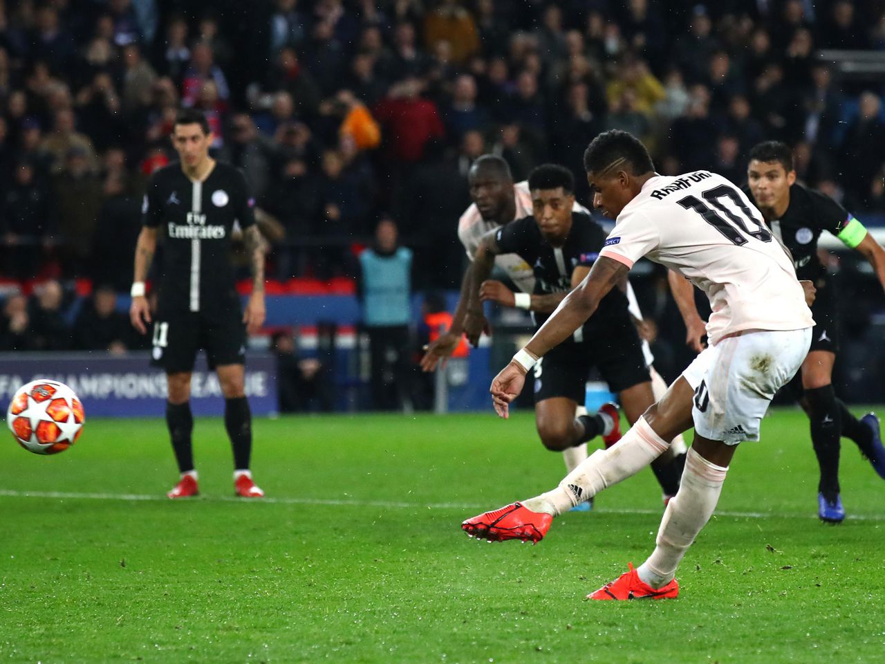 Marcus Rashford taking a penalty against PSG. 