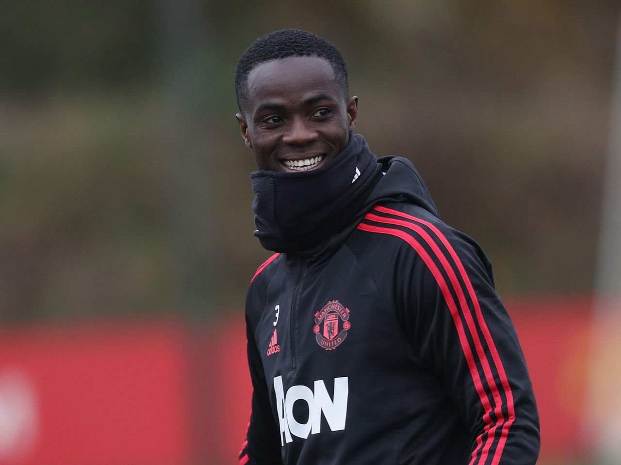 Eric Bailly smiles during a training session at the Aon Training Complex
