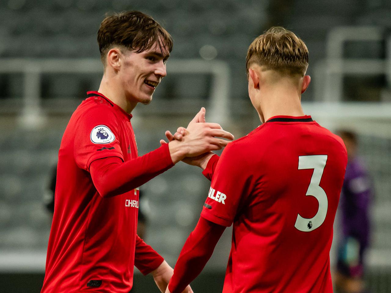 James Garner and Brandon Williams celebrate a goal.