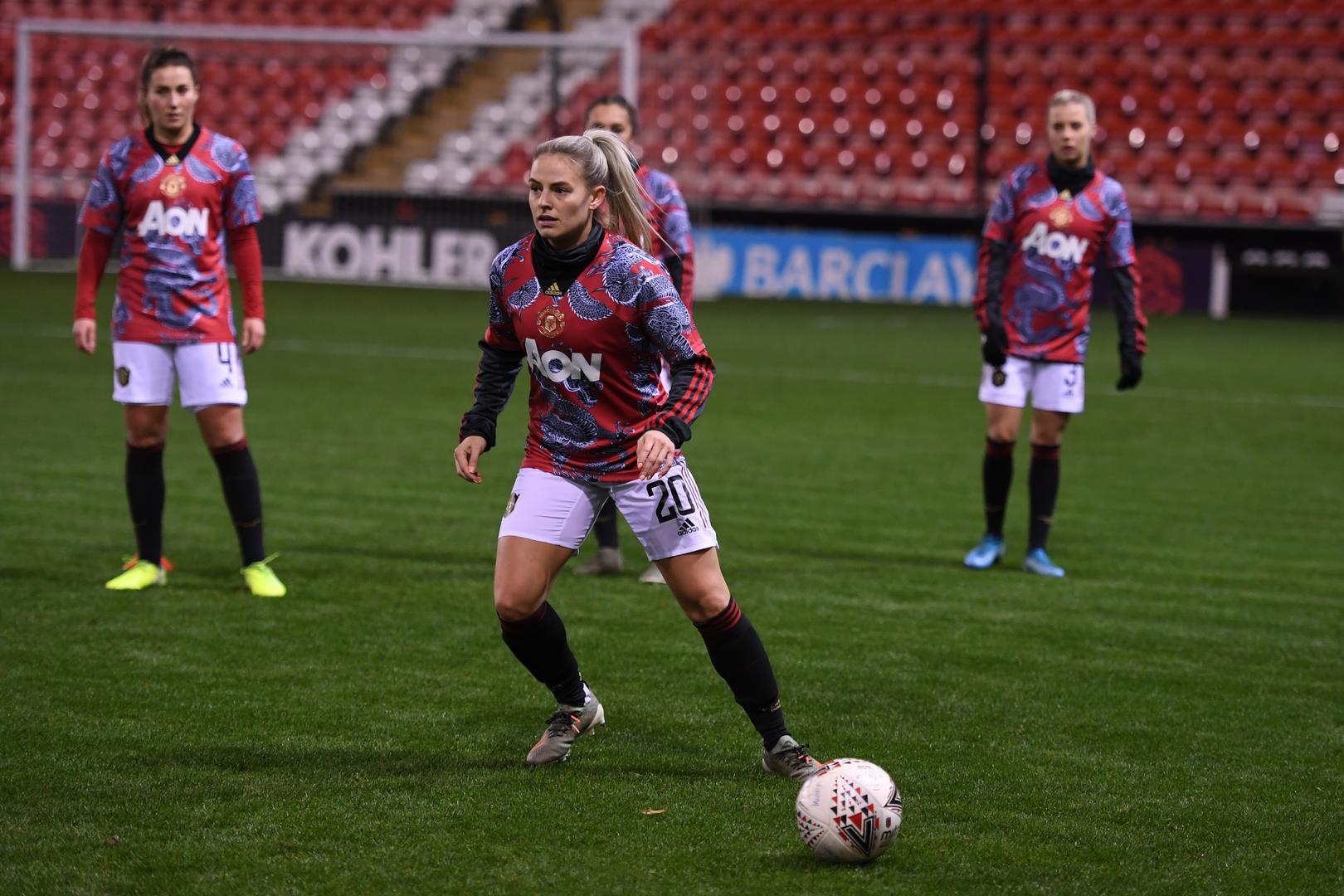 United Women players including Kirsty Smith warm up for a Continental League Cup game at Leigh Sports Village