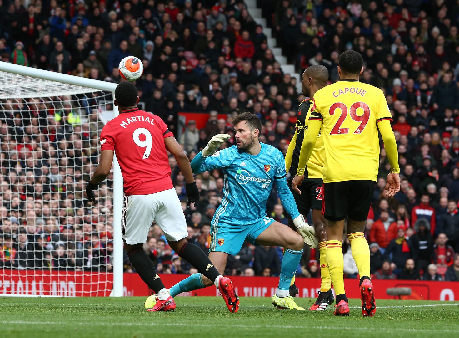 Anthony Martial lofts the ball over Ben Foster.