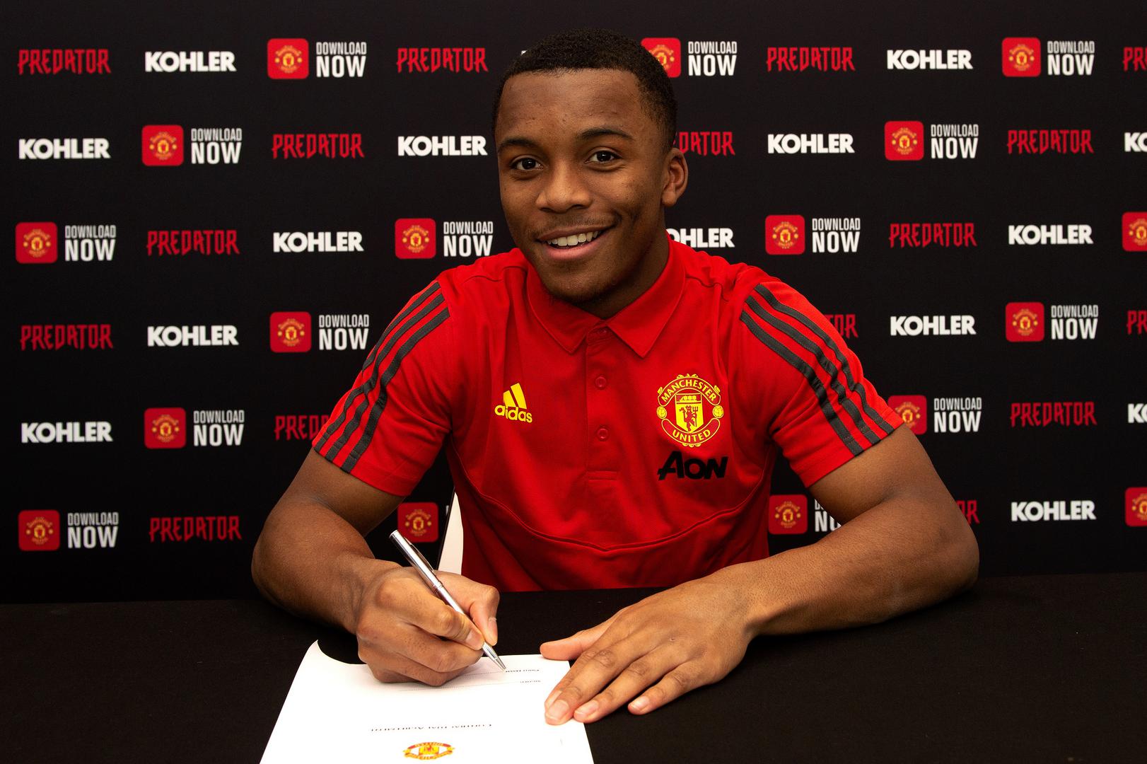 Ethan Laird puts pen to paper.