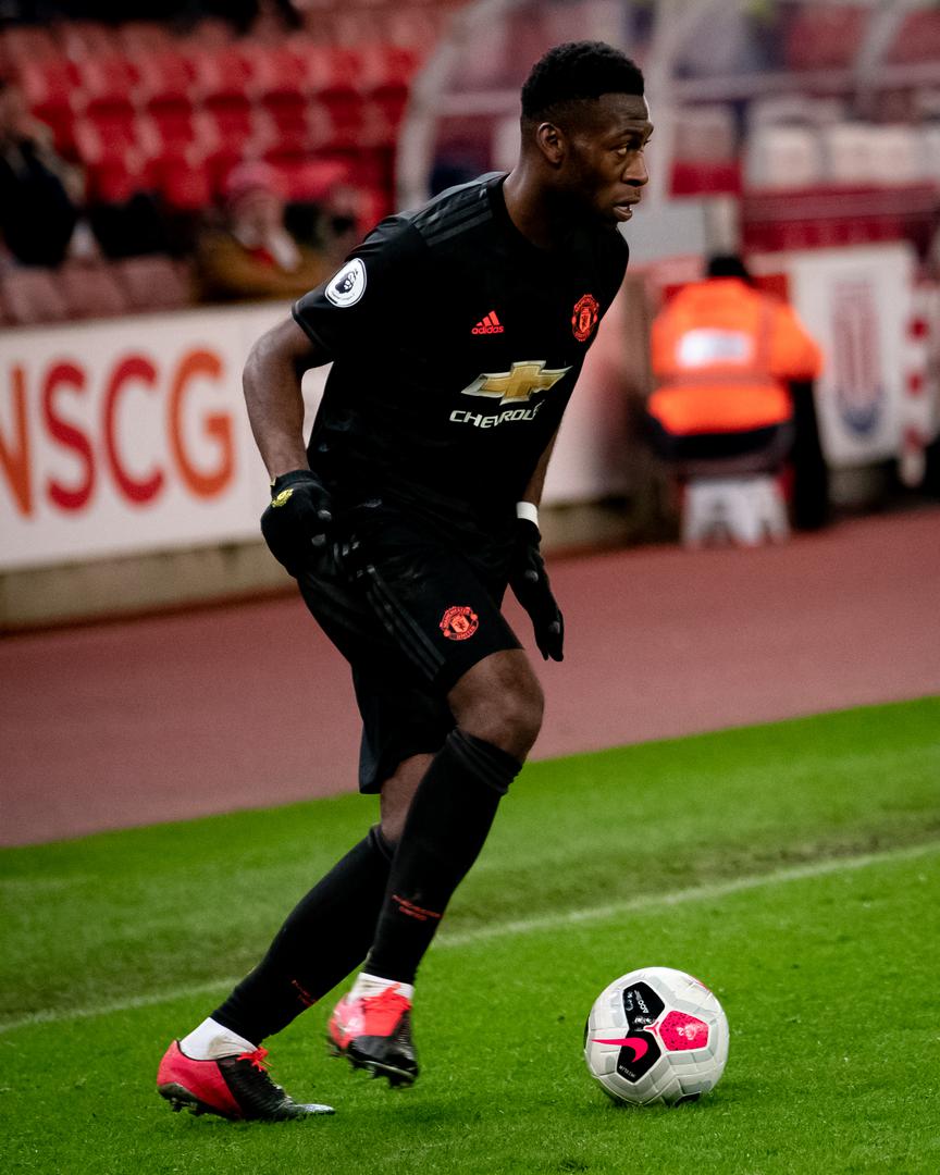 Tim Fosu-Mensah on the ball against Stoke City Under-23s