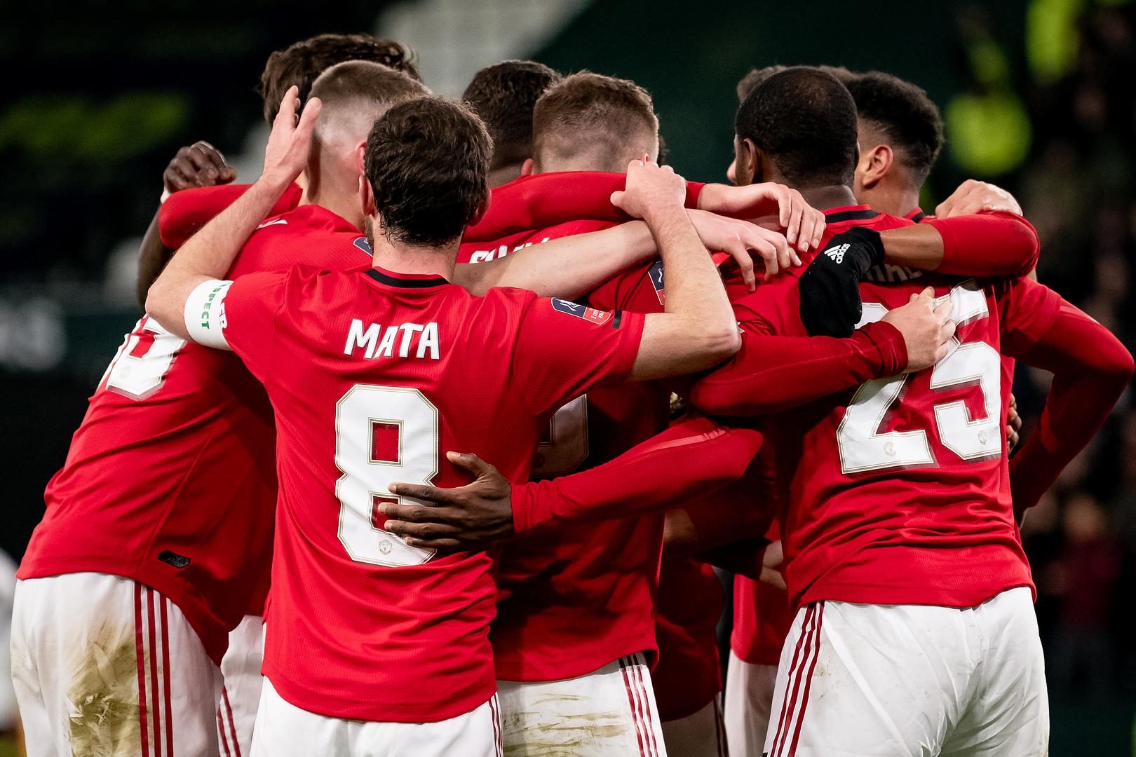 Manchester United players celebrate a goal against Derby County in the Emirates FA Cup