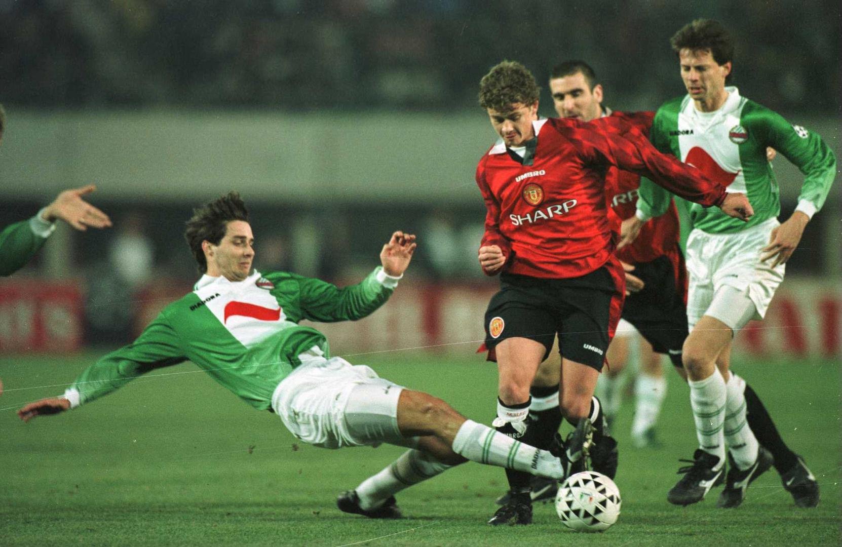 Ole Gunnar Solskjaer is tackled during a Rapid Vienna match