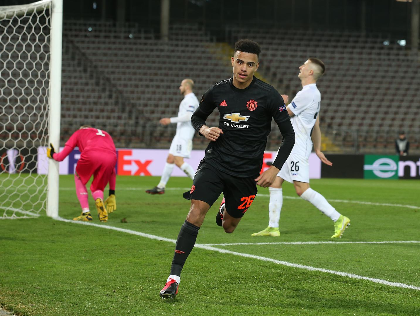 Mason Greenwood wheels away after scoring.
