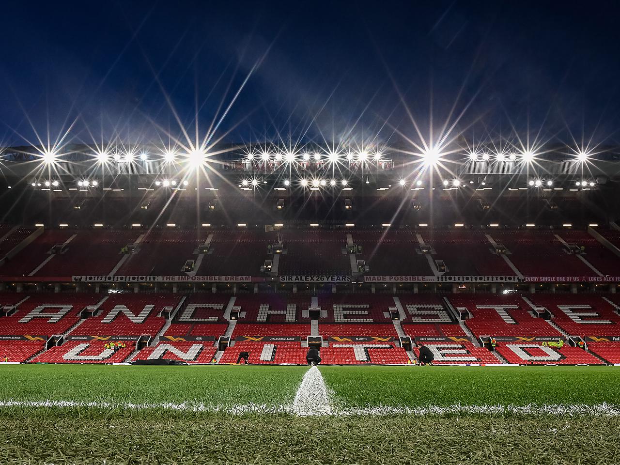 Old Trafford pitch under floodlights