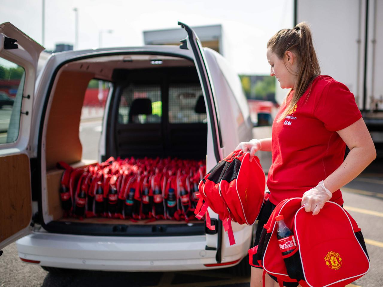 Manchester United Foundation staff deliver activity packs.