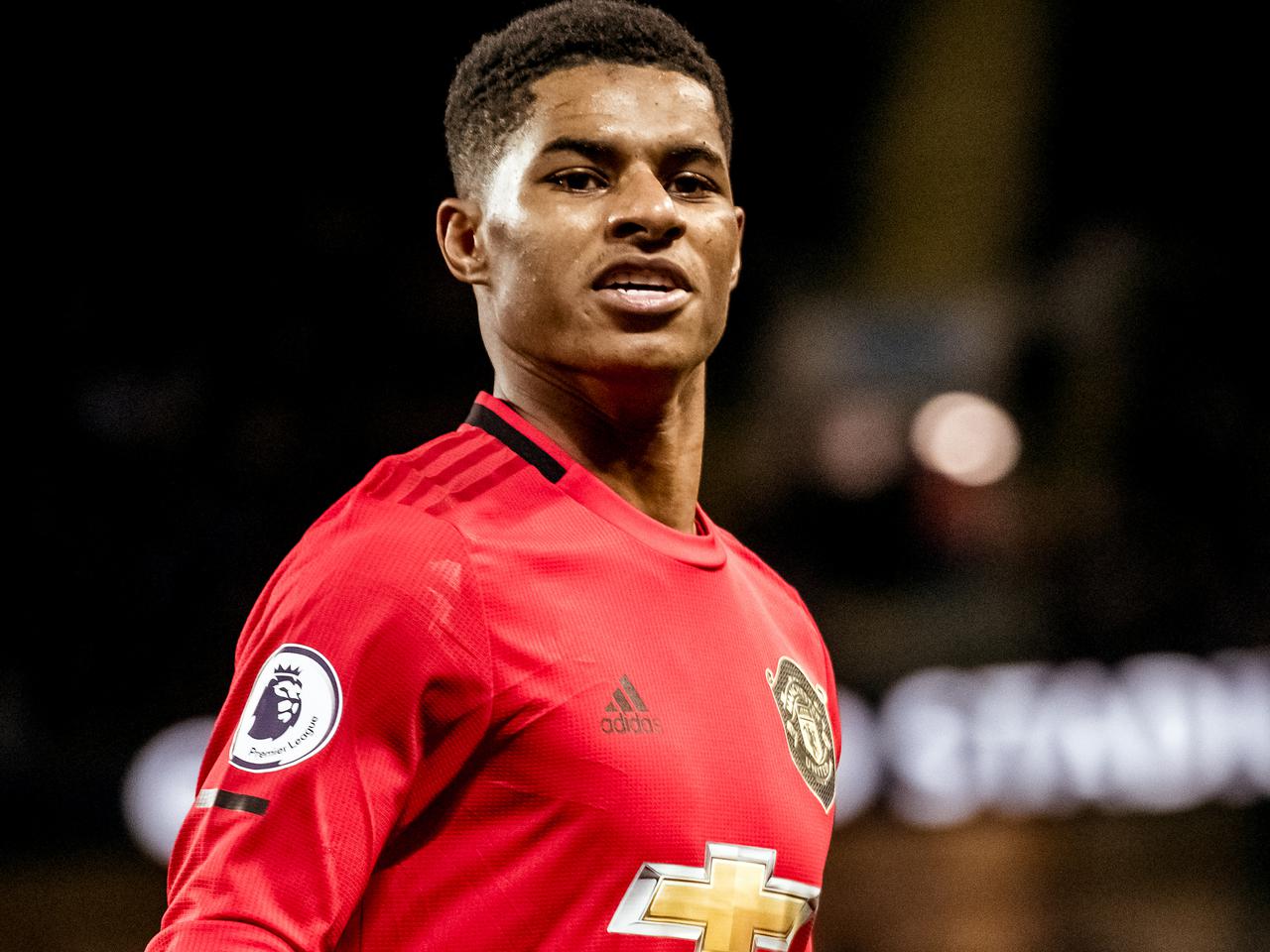 Marcus Rashford celebrates scoring against Manchester City.