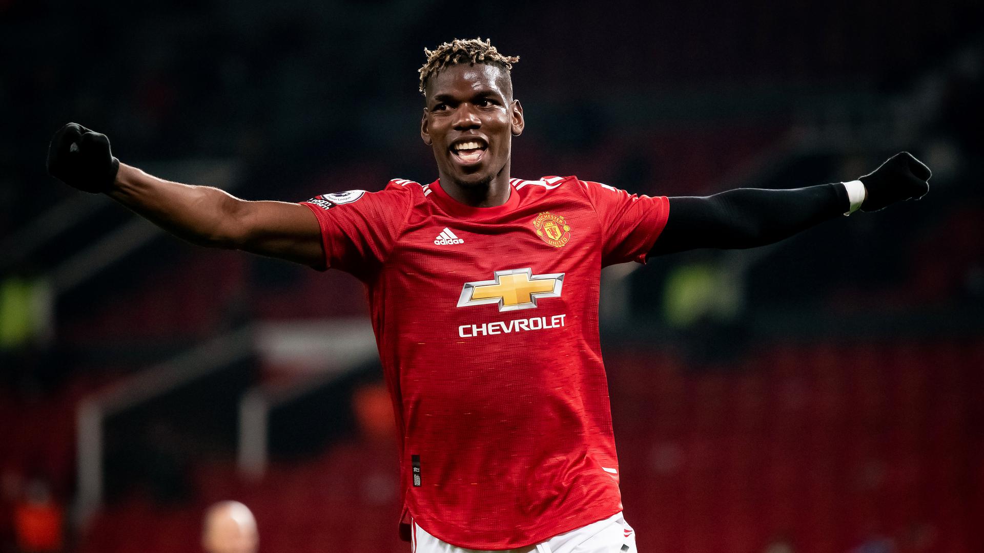 Paul Pogba wearing a tiger T-shirt, leather jacket and specs.