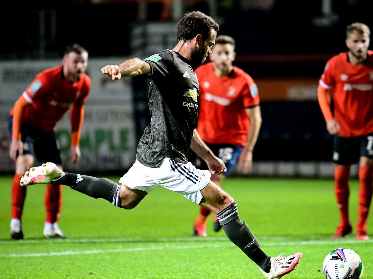 Juan Mata scores from the spot.