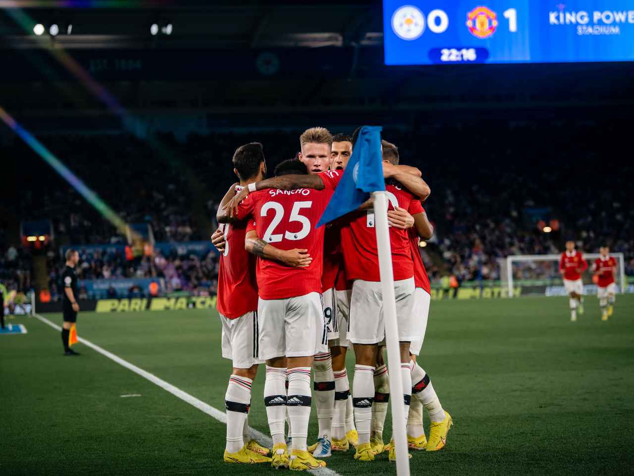 The Reds celebrate Sancho's winning goal.