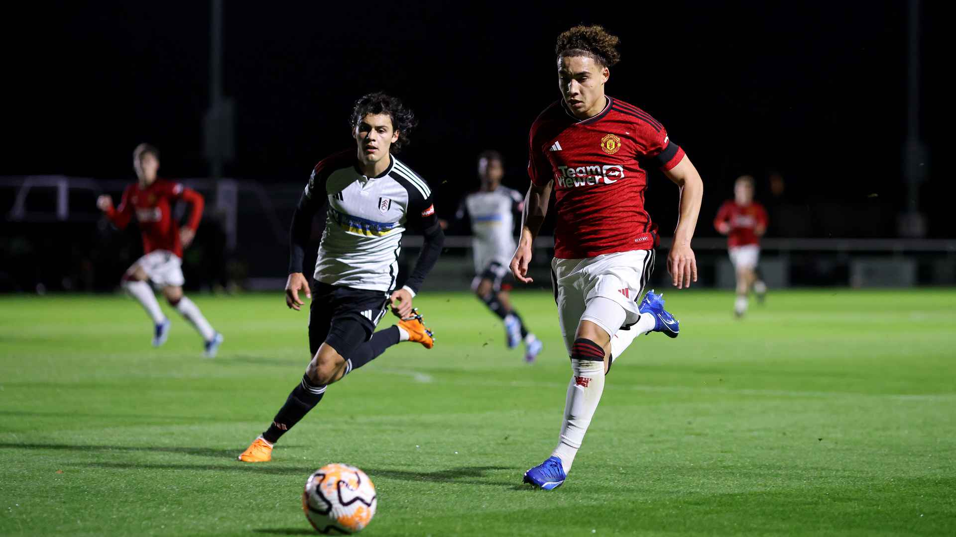Sam Murray looks to charge forward for the Reds.
