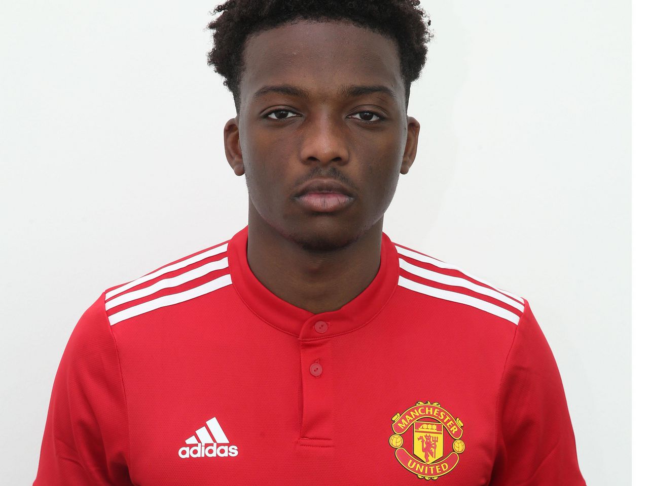 Matty Willock posing in his United kit.